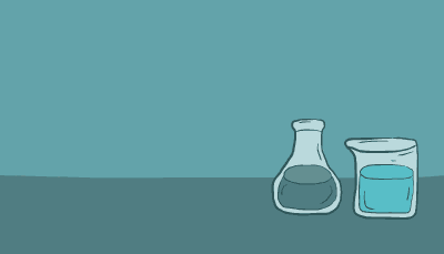 A scientist in blue goggles walks up to a counter and analyzes an item on a table