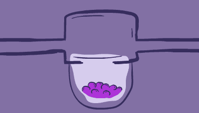 A pipette drops a blue liquid into a well with a mass of cells on a 3D culture plate